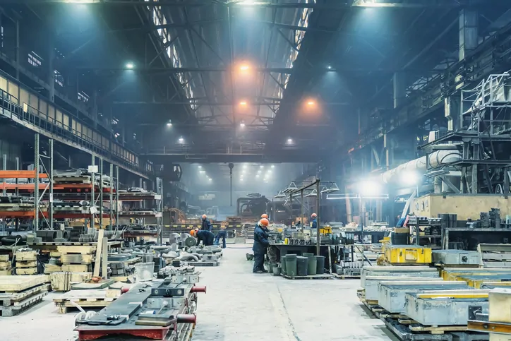 Interior of metalworking factory workshop hangar. Modern industrial enterprise production.